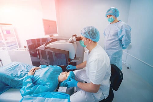 Eye surgeon performing LASIK surgery