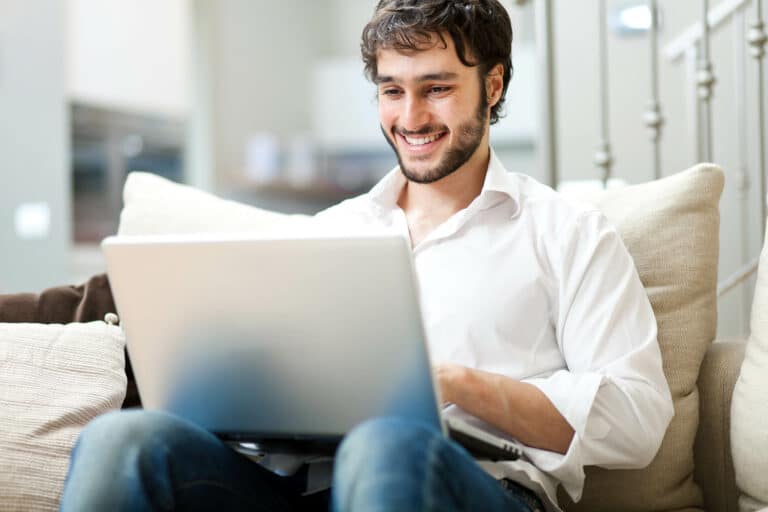 Man working on a computer casual setting