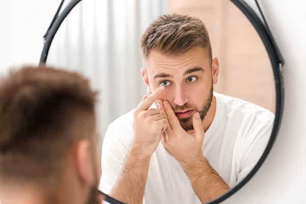 Person Putting in Contact Lenses